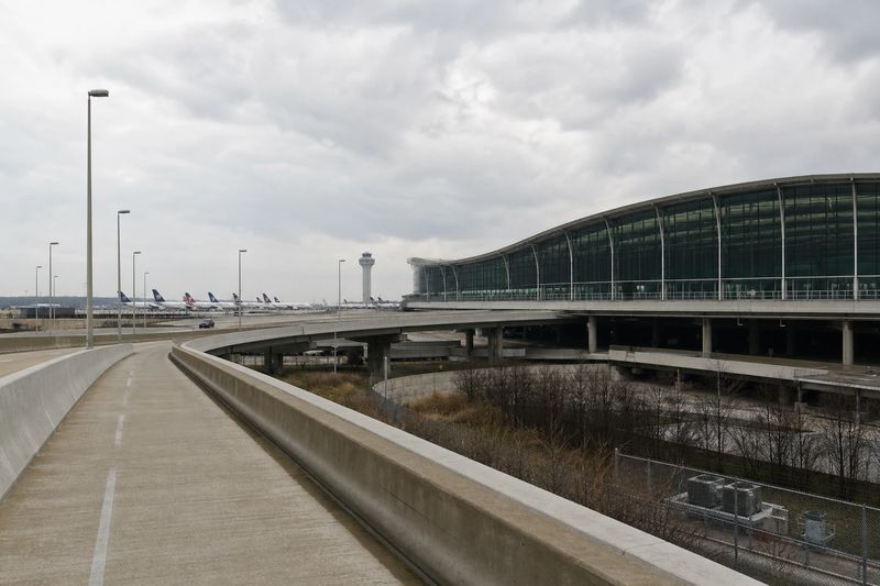 Aircraft at gates alongside a terminal concourse at O'Hare International Airport